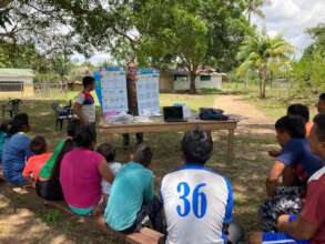 Outdoor community education session in Piaroa