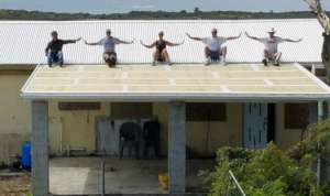 A critical need is met: a new roof is celebrated!