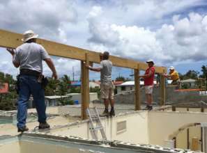 Members of the LTRG working to restore a roof.
