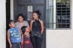 Lilian with her children and new Habitat home