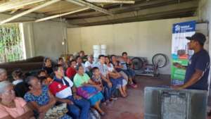 Families receiving a training from Habitat staff