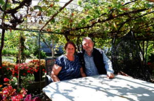 Naim and Drita in their yard.