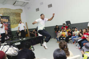Children enjoying breakdancing performance