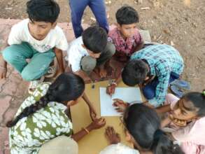 Children doing safety mapping of their village