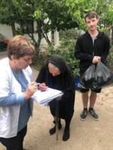 Social Worker Aliya from NG delivers supplies