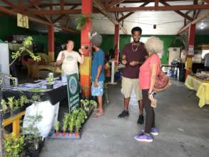 SEA staff providing education during tree giveaway