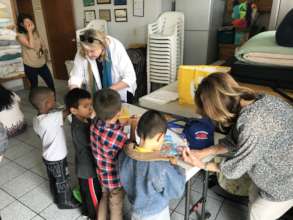 Donors visiting children at Madre Assunta shelter