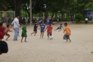 Students enjoying football drills at Helping Hands