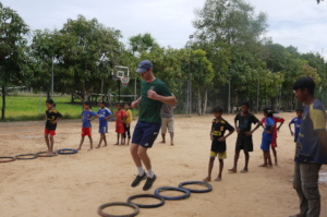 Coaches leading teamwork games in Siem Reap