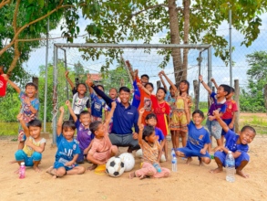 Coach with the children in Cambodia