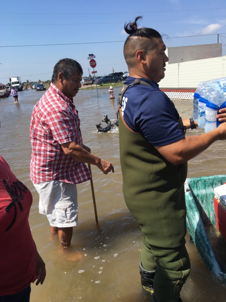 Distributing water to flood survivors.