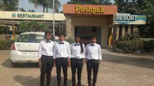 Aftercare children posing outside their work place