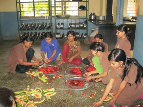 Girls from Orphanage cutting & serving watermelon