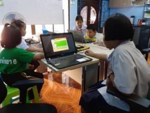 Computer class with younger children in groups