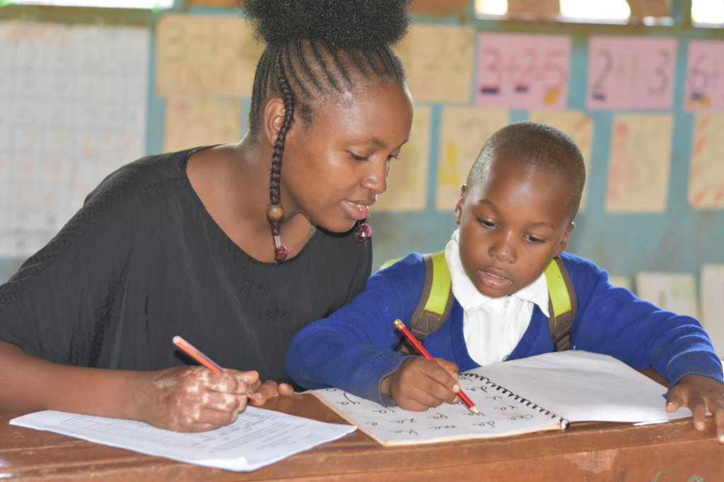 Tutor working with student