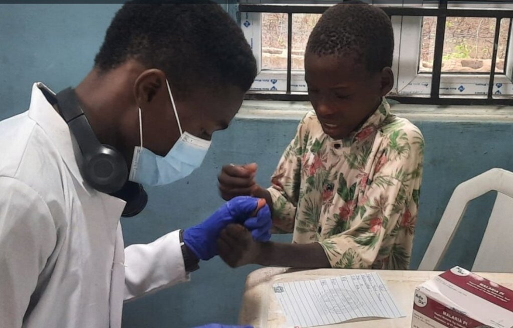 Treat malaria, give food to a child in Nigeria.