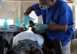 A young Haitian boy receiving free dental care.