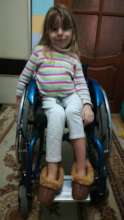 Arina with her new wheelchair