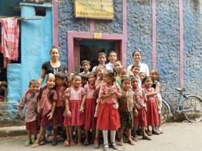 A class of children  in front of the old School.