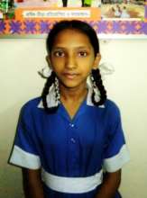Jannatul in her home in the slums of Dhaka