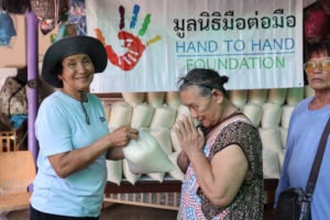 Collecting rice at Hand to Hand