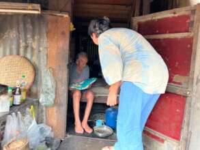 Visiting people in their home and bringing food.