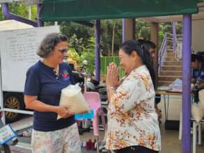 Coming to our centre to receive rice.