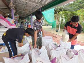 Students helping to pack rice.
