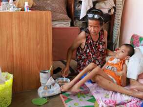A grandma cares for her disabled grandson