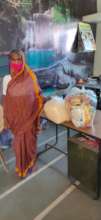 An old woman helped with essentials