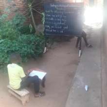 One of the older students learning outside