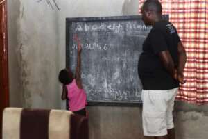 Amador practicing his alphabet at home