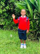 Akim in his school uniform
