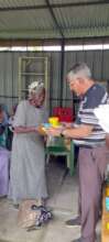 Elderly women of the community receiving gifts