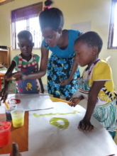Grace encourges children to be creative with paint