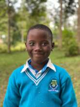 Fatuma, shining in Mayuge Junior school uniform