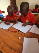 Jovan and freind learn to use a pencil