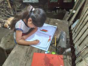 Marleni working on her radio booklet