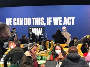 CAN DO IF WE ACT NOW wall banner at COP26