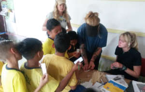 Students prepare labels for baby trees