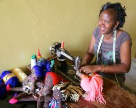 Susan, founder of AfriKnit Dolls