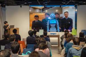 Presenting their work at a symposium