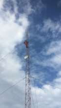 One of our workers repairing an existing antenna