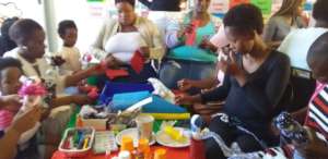 Happy parents making puppets and instruments