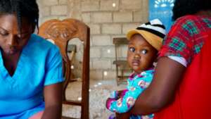 A mom with her daughter at the clinic.