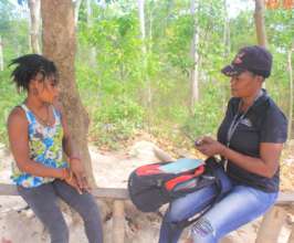 A caseworker meeting with a program participant.