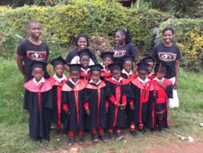 Our 11 nursery school grads ready for 1st grade!