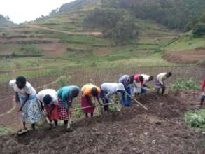 Girl's in Our Empowerment Program Planting Beans