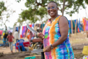 At Amugu pop-up market visiting a beneficiary