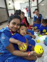 Smiling their way to OT-Students playing with Kids